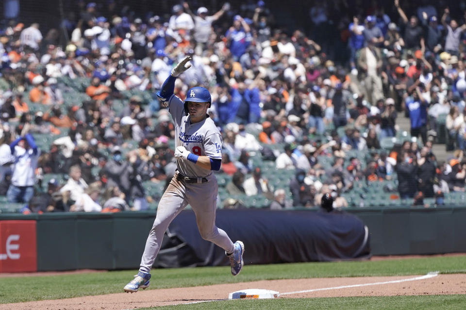 Los Angeles Dodgers' Gavin Lux rounds the bases after hitting grand slam against the San Francisco Giants during the third inning of a baseball game in San Francisco, Sunday, May 23, 2021. (AP Photo/Jeff Chiu)