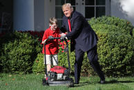 <p>11-year-old Frank “FX” Giaccio (L) gets a pat on the back from U.S. President Donald Trump (C) while mowing the grass in the Rose Garden of the White House September 15, 2017 in Washington, DC. Giaccio, from Falls Church, Virginia, who runs a business called FX Mowing, wrote a letter to Trump expressing admiration for Trump’s business background and offered to mow the White House grass. (Photo: Win McNamee/Getty Images) </p>