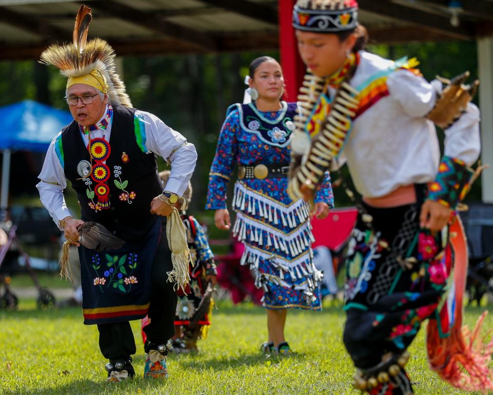 Robert Van Zile Jr., left, chairman of the Mole Lake Ojibwe Tribe, dances during the Manoomin Powwow celebrating the wild rice season in September 2023. Wild rice carries great cultural and nutritional importance to the tribe.
