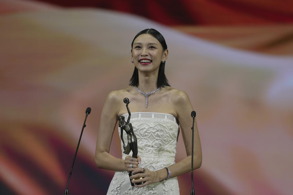 Hong Kong actress Louise Wong, celebrates after winning the Best New Performer Award for the movie "Anita" at the Hong Kong Film Awards, Sunday, July 17, 2022. (AP Photo/Kin Cheung)