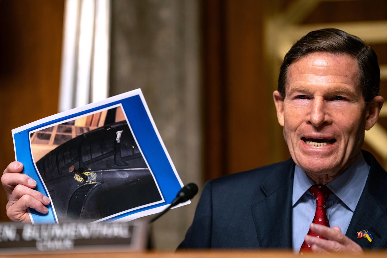 WASHINGTON, DC - APRIL 17: Chairman Sen. Richard Blumenthal (D-CT) holds up a photograph of the tire of whistleblower Sam Salehpour that was punctured by a nail, during a Senate Homeland Security and Governmental Affairs subcommittee on investigations hearing titled 