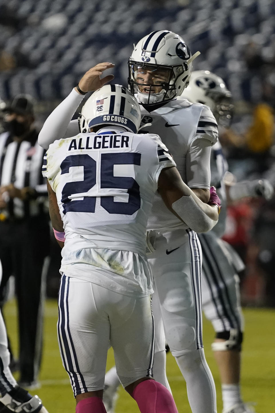 BYU's quarterback Zach Wilson, right, celebrates with running back Tyler Allgeier (25) after Allgeier scored against Western Kentucky during the first half of an NCAA college football game Saturday, Oct. 31, 2020, in Provo, Utah. (AP Photo/Rick Bowmer, Pool)