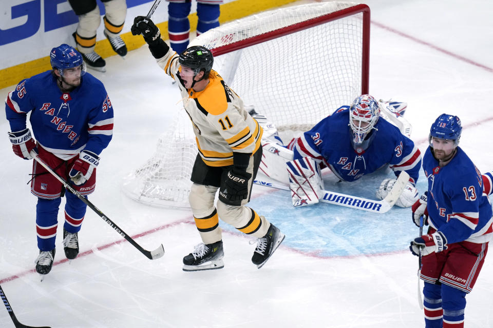 Boston Bruins center Trent Frederic (11) celebrates after his goal against New York Rangers goaltender Igor Shesterkin (31) during the second period of an NHL hockey game, Saturday, Dec. 16, 2023, in Boston. (AP Photo/Charles Krupa)