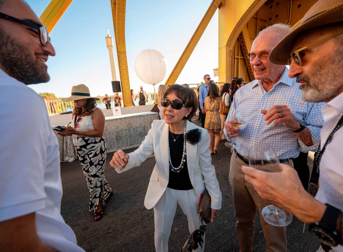 Congresswoman Doris Matsui, D-Sacramento, stands with her husband Roger Sant, second from right, while talking with friends at the Tower Bridge Dinner on Sunday.