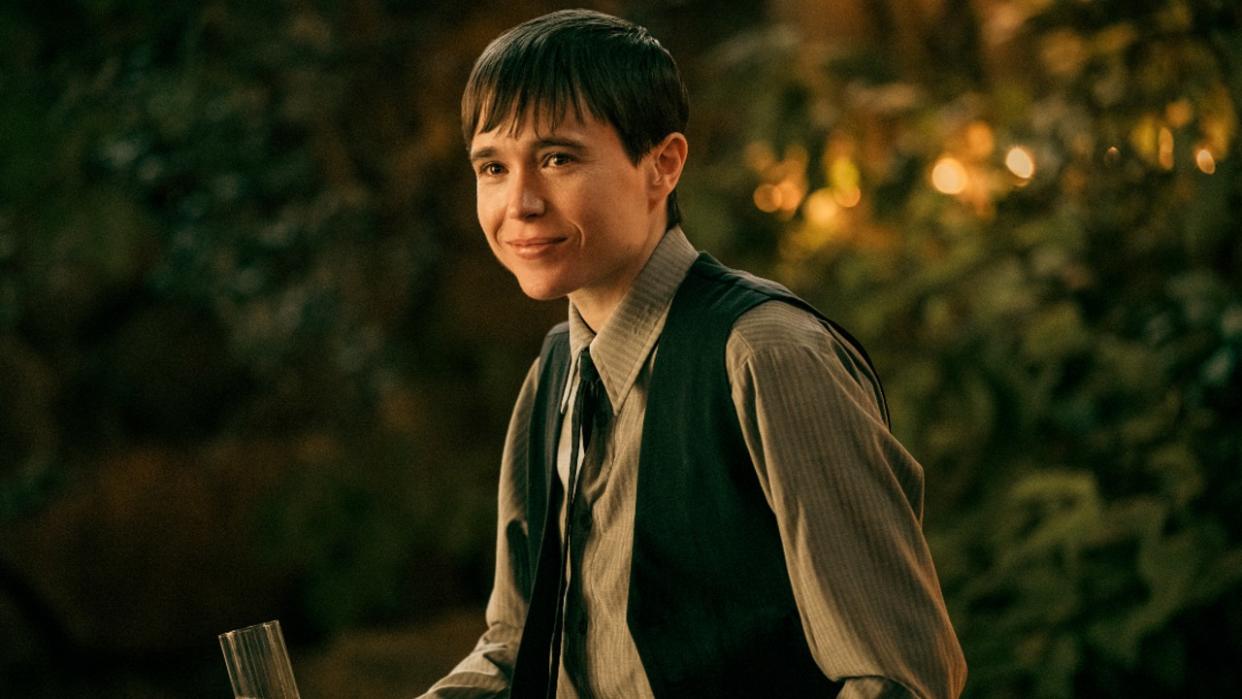  Elliot Page as Victor smiling in a press image from Season of The Umbrella Academy. 