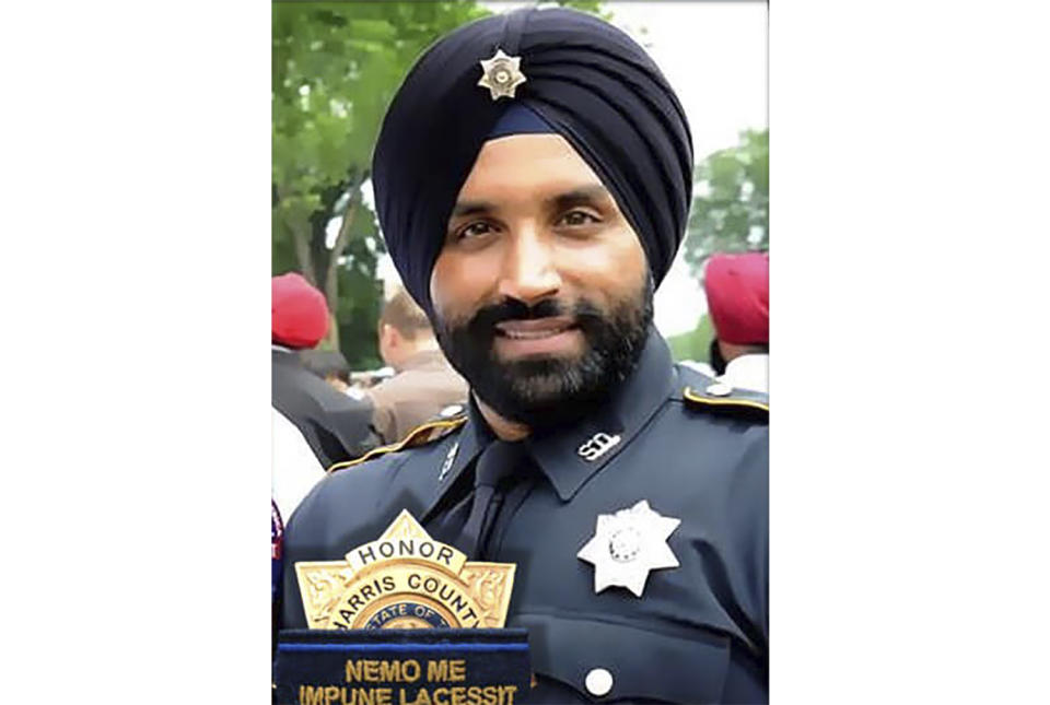 This photo provided by Harris County Sheriff's Office shows Deputy Sandeep Dhaliwal. The funeral for Dhaliwal, a Texas sheriff’s deputy who was fatally shot during a traffic stop, will be held Wednesday, Oct. 2, 2019, at the Berry Center in Cypress, near Houston. Dhaliwal, who was slain on Friday, Sept. 27 was the first Sikh deputy on the force. (Harris County Sheriff's Office via AP)