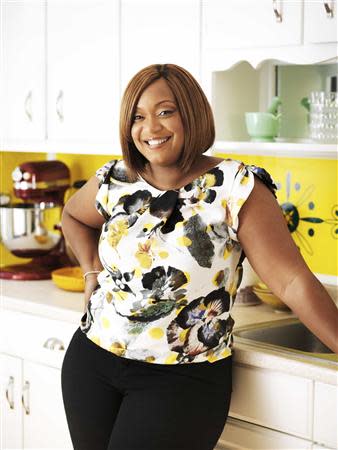 Celebrity chef Sunny Anderson is shown in this undated handout photo taken in her kitchen in Brooklyn, New York and provided by Clarkson Potter on October 21, 2013. REUTERS/John Lee/Clarkson Potter/Handout via Reuters