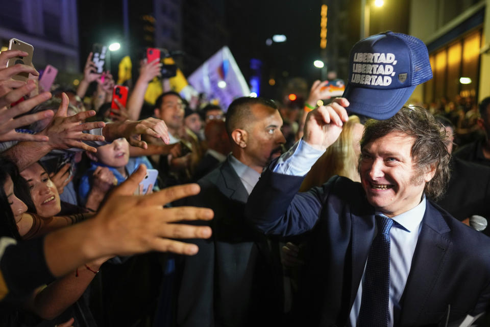 Javier Milei, presidential candidate of the Liberty Advances coalition, greets supporters outside his campaign headquarters after polls closed for general elections in Buenos Aires, Argentina, Sunday, Oct. 22, 2023. (AP Photo/Natacha Pisarenko)