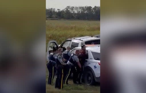 Myles Sanderson is shown under arrest moments after RCMP forced his stolen truck off the highway.  (Dabber Gamble/Facebook - image credit)