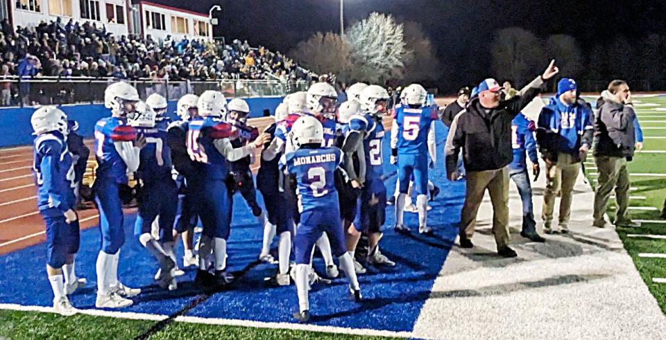 Warner players and coaches celebrate after scoring a touchdown during the Monarchs' 37-16 victory over Canistota in a Class 9A state semifinal football playoff game on Friday, Nov. 3, 2023 in Warner.