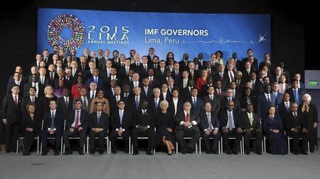 International Monetary Fund (IMF) governors pose for a family photo during the 2015 IMF/World Bank Annual Meetings plenary session in Lima, Peru, October 9, 2015. REUTERS/Stringer