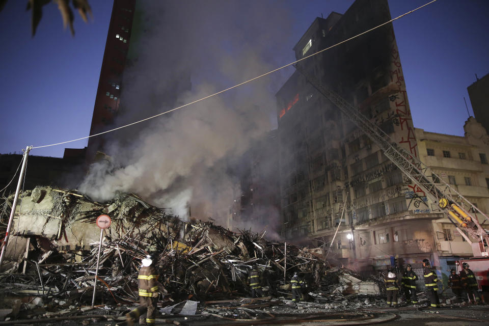 <p>Firefighters work in the the rubble of a building that caught fire and collapsed in Sao Paulo, Brazil, Tuesday, May 1, 2018. (Photo: Andre Penner/AP) </p>