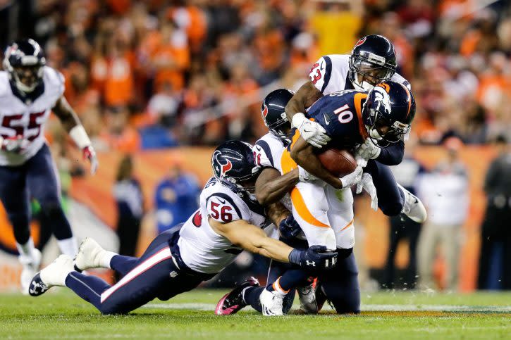 Oct 24, 2016; Denver, CO, USA; Denver Broncos wide receiver Emmanuel Sanders (10) is tackled by Houston Texans defensive back Corey Moore (43) and defensive back Charles James (31) and inside linebacker Brian Cushing (56) in the second quarter at Sports Authority Field at Mile High. Mandatory Credit: Isaiah J. Downing-USA TODAY Sports