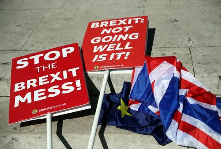 Anti-Brexit placards are seen on the floor outside the Houses of Parliament in London, Britain, May 13, 2019. REUTERS/Hannah McKay