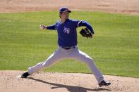 Texas Rangers starting pitcher Kohei Arihara, of Japan, throws a pitch against the Chicago White Sox during the first inning of a spring training baseball game Tuesday, March 2, 2021, in Phoenix. (AP Photo/Ross D. Franklin)