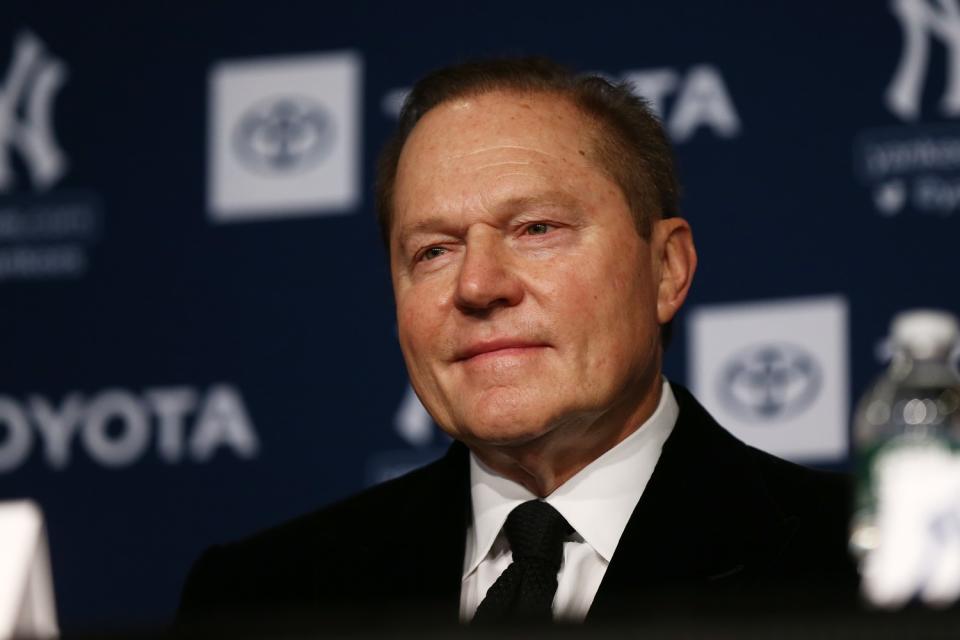 Sports agent Scott Boras looks on during a news conference.