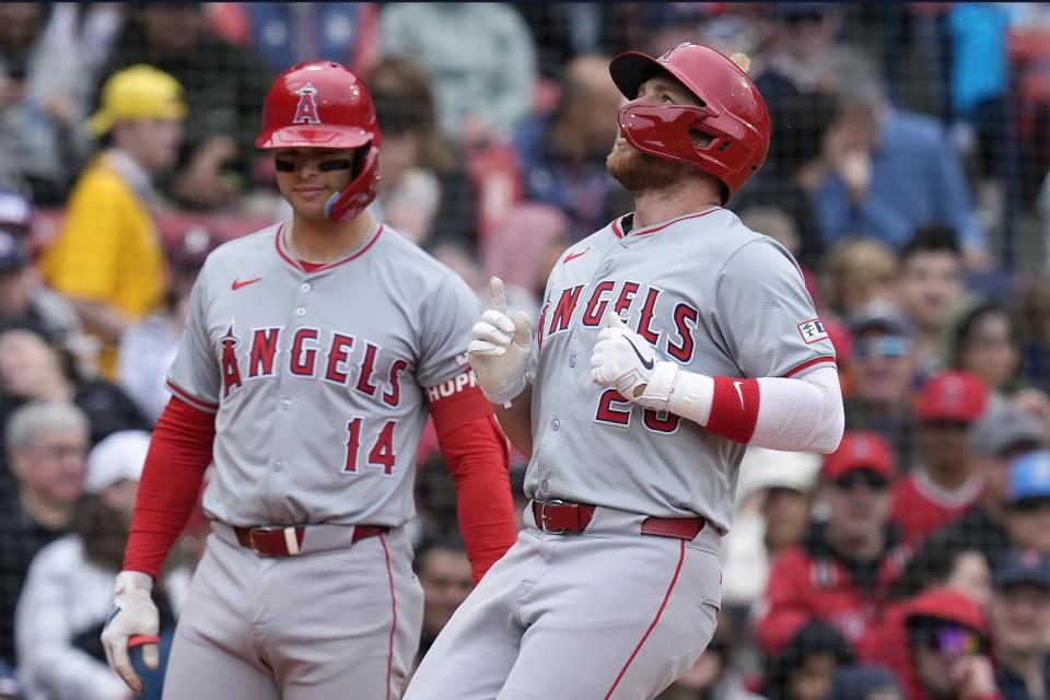 Los Angeles Angels' Brandon Drury, right, celebrates after his solo home run in front of teammate Logan O'Hoppe (14) during the second inning of a baseball game against the Boston Red Sox, Sunday, April 14, 2024, in Boston. (AP Photo/Michael Dwyer)