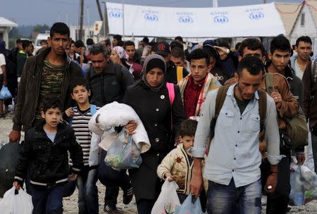 Migrants wait for transport at a transit camp in Gevgelija, Macedonia, after entering the country by crossing the border with Greece, September 24, 2015. REUTERS/Ognen Teofilovski