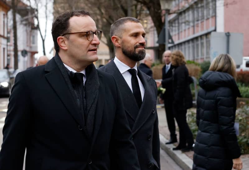 Jens Spahn (L), former German Minister of Health, arrives with his husband, Daniel Funke, at the funeral service for Wolfgang Schauble. Philipp von Ditfurth/dpa