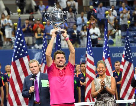 Sept 11, 2016; New York, NY, USA; Stan Wawrinka of Switzerland celebrates with the championship trophy after beating Novak Djokovic of Serbia in the men's singles final on day fourteen of the 2016 U.S. Open tennis tournament at USTA Billie Jean King National Tennis Center. Mandatory Credit: Robert Deutsch-USA TODAY Sports