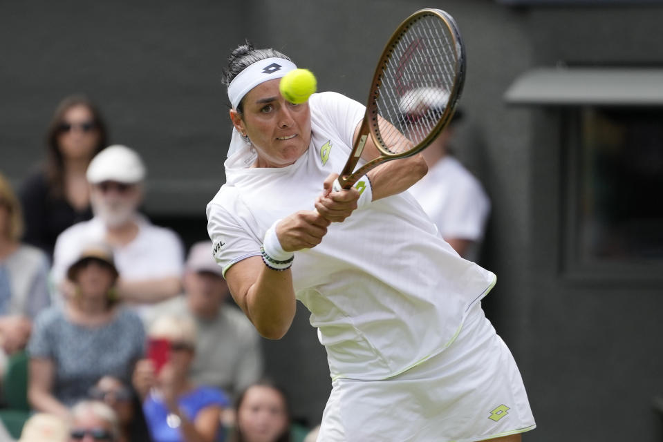 Tunisia's Ons Jabeur returns to Kazakhstan's Elena Rybakina in a women's singles match on day ten of the Wimbledon tennis championships in London, Wednesday, July 12, 2023. (AP Photo/Kirsty Wigglesworth)