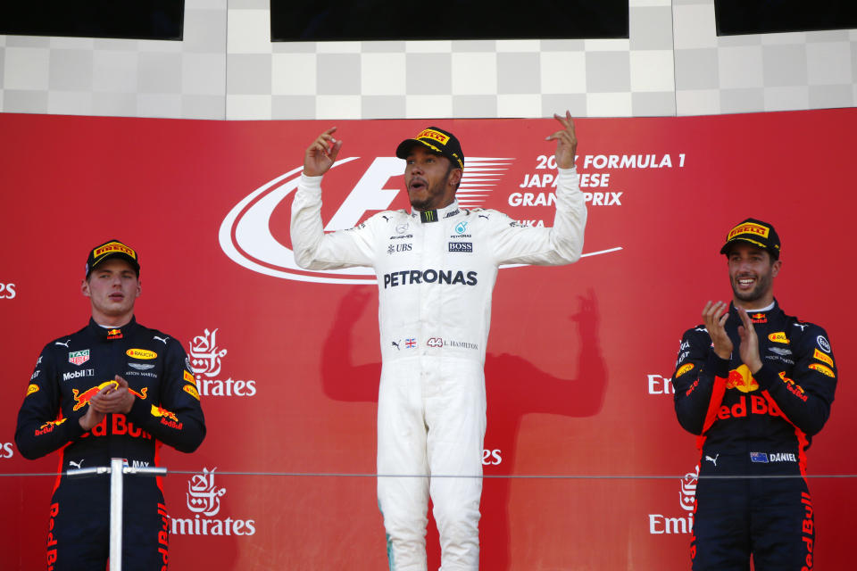 Top of their game: Verstappen, Hamilton and Ricciardo celebrate at Suzuka as Red Bull score another double podium finish