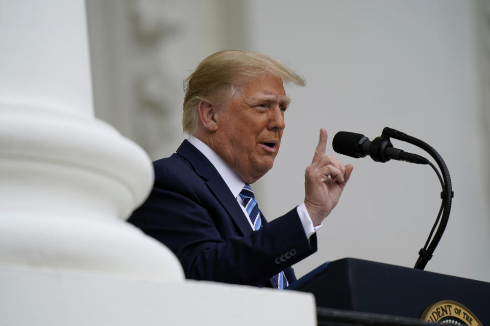 President Donald Trump speaks from the Blue Room Balcony of the White House to a crowd of supporters, Saturday, Oct. 10, 2020, in Washington. (AP Photo/Alex Brandon)