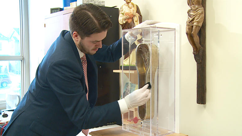 Catholics flock to Calgary church for glimpse of 465-year-old saint's arm