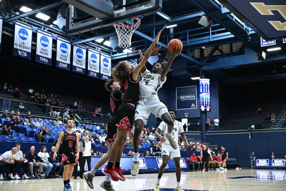 Akron Zips forward Ali Ali elevates for a layup against Miami-Hamilton on Dec. 17, 2023.