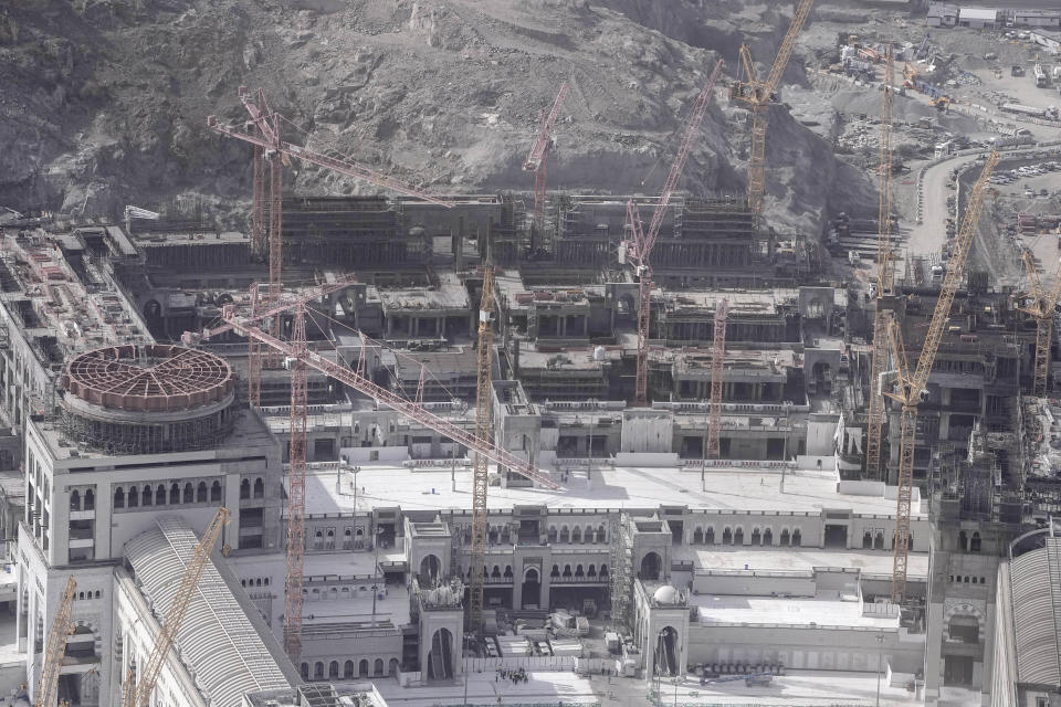 Cranes are seen on the new extension of the Grand Mosque during the Hajj pilgrimage in the Muslim holy city of Mecca, Saudi Arabia, Sunday, June 25, 2023. Saudi Arabia is pumping billions of dollars into the holy city of Mecca to meet its ambitious economic targets, with high-end hotels, apartment blocks, retailers and restaurants planned for areas around the Grand Mosque. (AP Photo/Amr Nabil)