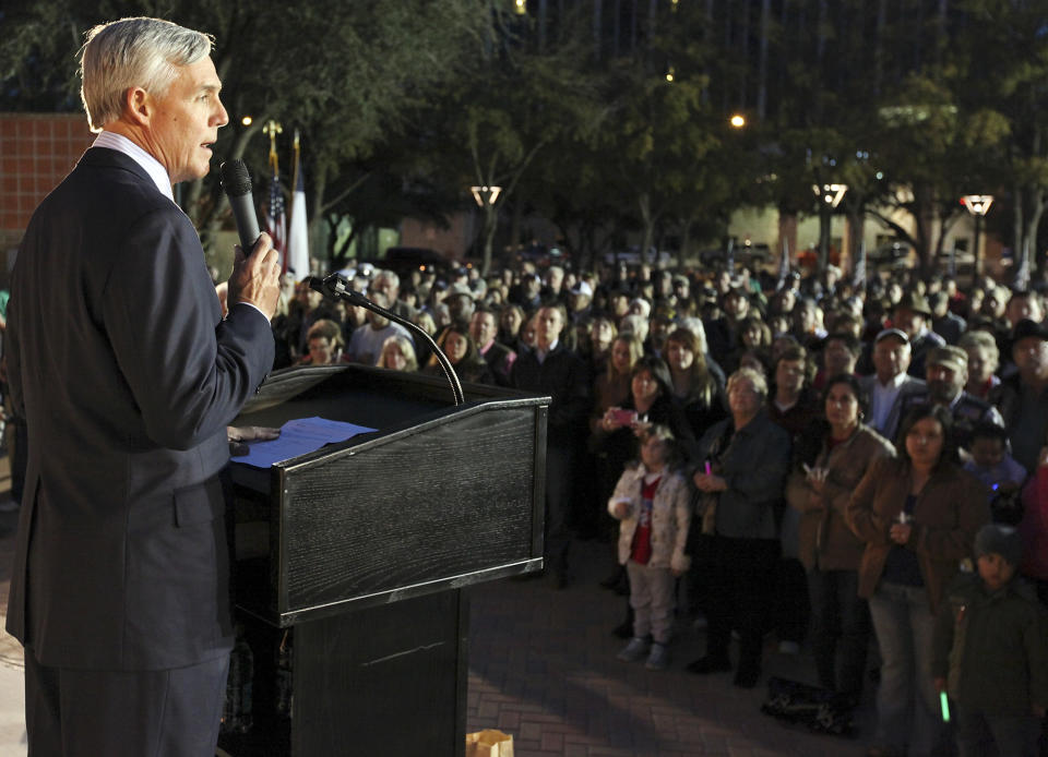 Midland Mayor Wes Perry speaks during a candlelight vigil held at Centennial Plaza in Midland, Texas on Saturday, Nov. 17, 2012 in honor of the people involved in an accident where a Union Pacific train struck a float carrying military veterans on Thursday, Nov. 15, 2012. Four veterans were killed, including one from the San Antonio area. (AP Photo/San Antonio Express-News, Edward A. Ornelas)