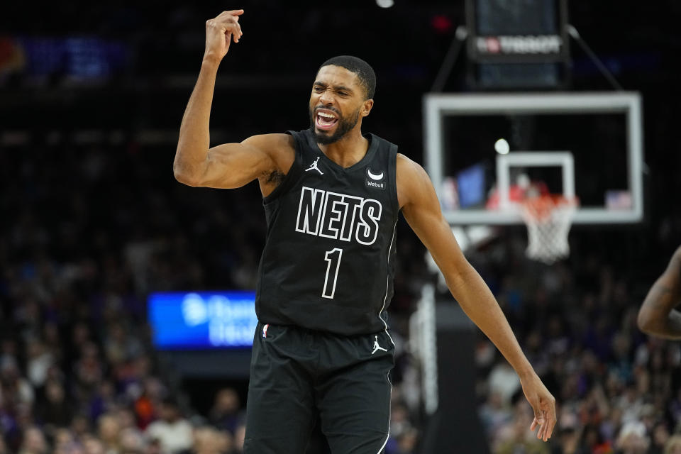 Brooklyn Nets forward Mikal Bridges celebrates as basket against the Phoenix Suns during the second half of an NBA basketball game, Wednesday, Dec. 13, 2023, in Phoenix. (AP Photo/Matt York)