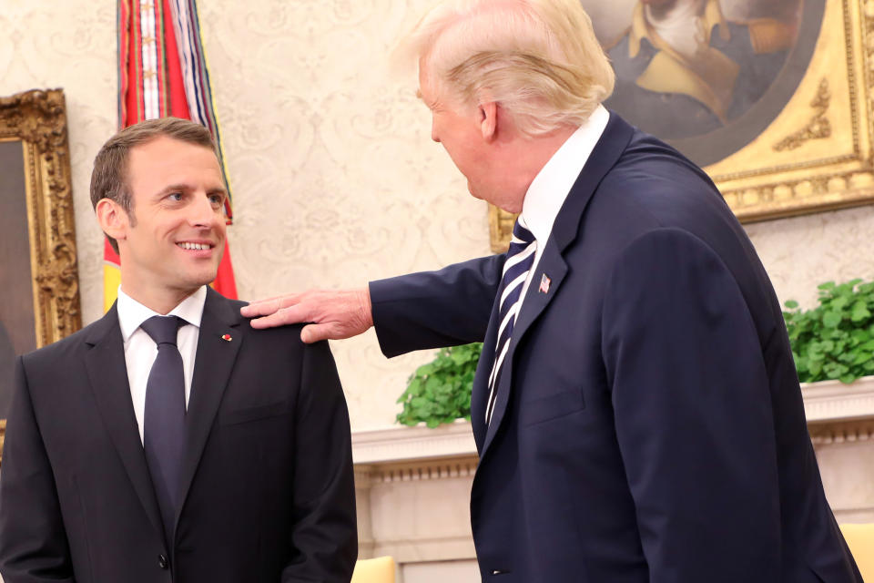 Trump made a point of brushing dandruff of Macron’s lapel