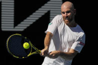 Adrian Mannarino of France makes a backhand return to Rafael Nadal of Spain during their fourth round match at the Australian Open tennis championships in Melbourne, Australia, Sunday, Jan. 23, 2022. (AP Photo/Simon Baker)