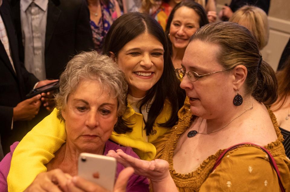 Haley Stevens takes selfies as she celebrates Michigan's 11th District victory with friends, colleagues and family at the Townsend Hotel in Birmingham on Aug. 2, 2022.