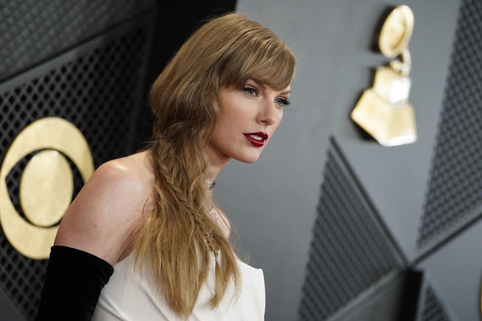 FILE - Taylor Swift arrives at the 66th annual Grammy Awards on Feb. 4, 2024, in Los Angeles. Some conservatives on cable news or on social media have speculated that Taylor Swift is part of an elaborate plot to help Democrats win the November election. However, on the campaign trail, many voters just see that talk as noise to tune out. (Photo by Jordan Strauss/Invision/AP, File)