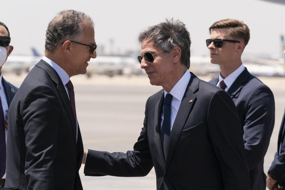 Secretary of State Antony Blinken, second from right, is greeted by U.S. Ambassador to Egypt Jonathan Cohen upon arrival at Cairo International Airport, Wednesday, May 26, 2021, in Cairo, Egypt. (AP Photo/Alex Brandon, Pool)