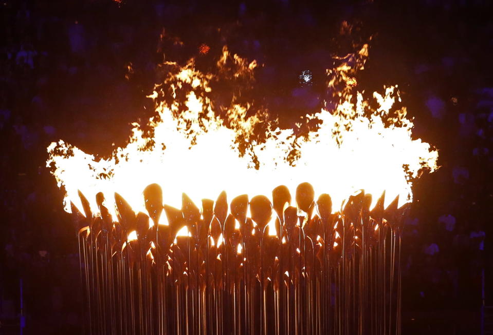 The Olympic cauldron burns after being lit during the Opening Ceremony at the 2012 Summer Olympics, Saturday, July 28, 2012, in London. (AP Photo/Jae C. Hong)