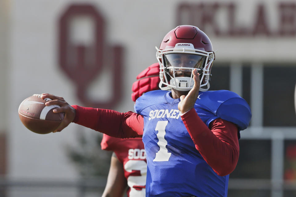 FILE - In this Monday, Aug. 5, 2019, file photo, Oklahoma quarterback Jalen Hurts throws during an NCAA college football practice in Norman, Okla. Hurts is competing with Tanner Mordecai, a redshirt freshman, and Spencer Rattler, a true freshman, to become starting quarterback.(AP Photo/Sue Ogrocki, File)