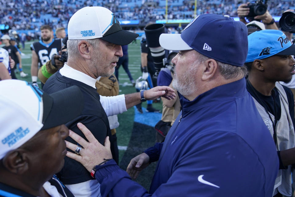 Carolina Panthers head coach Frank Reich and Dallas Cowboys head coach Mike McCarthy meet on the field after an NFL football game Sunday, Nov. 19, 2023, in Charlotte, N.C. (AP Photo/Erik Verduzco)