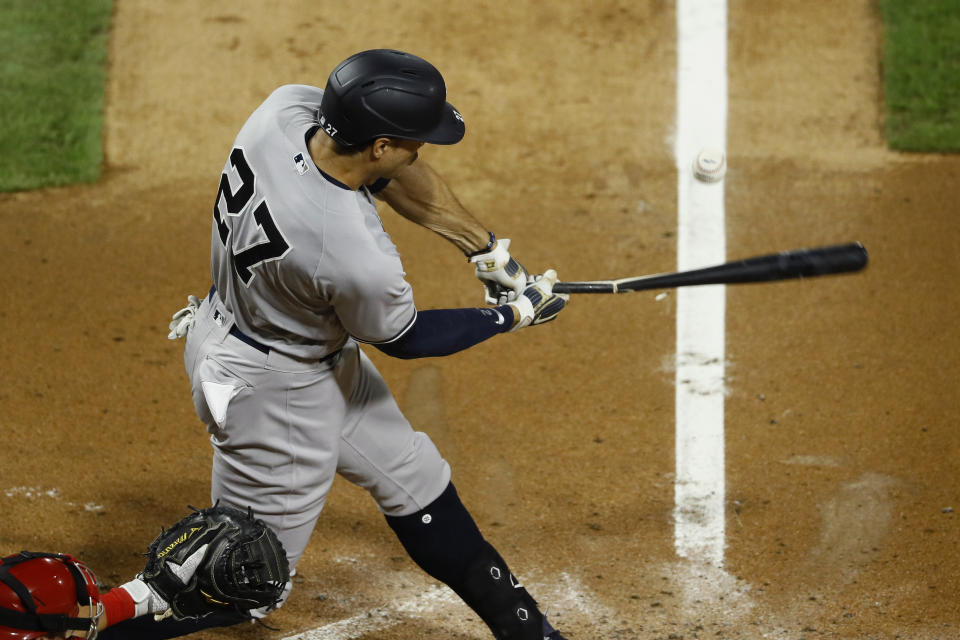 New York Yankees' Giancarlo Stanton breaks his bat on a pop out against Philadelphia Phillies starting pitcher Aaron Nola during the fourth inning of the second baseball game in a doubleheader, Wednesday, Aug. 5, 2020, in Philadelphia. (AP Photo/Matt Slocum)