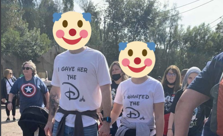 After theme park enthusiast Sam Carter tweeted this photo of a couple wearing suggestive t-shirts at Disneyland, some Twitter users commented saying Disney Parks should have stricter rules about which shirts are allowed. (Photo: Sam Carter)