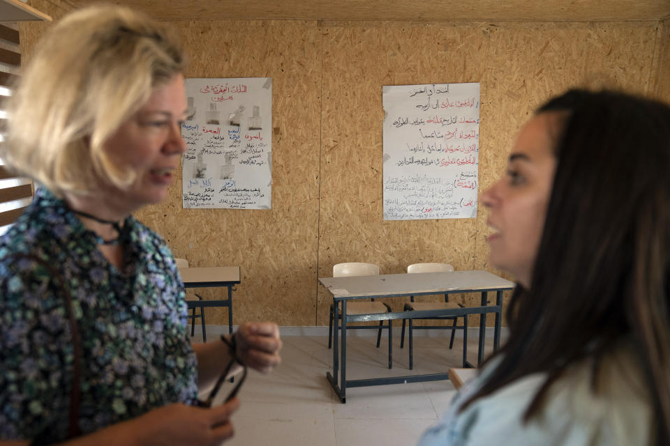 European Union representatives visit a school structure that is under the threat of demolition by the Israeli authorities, in the West Bank Bedouin community of Ein Samia, northeast of Ramallah, Friday, Aug. 12, 2022. The Israeli District Court in Jerusalem issued on Wednesday a decision to immediately demolish the Ein Samia school. Fifty four schools serving seven thousand Palestinian children in the West Bank's area "C" are under threat of demolition, Sven Kühn von Burgsdorff, the European Union's representative to the West Bank and Gaza told reporters. (AP Photo/Nasser Nasser)