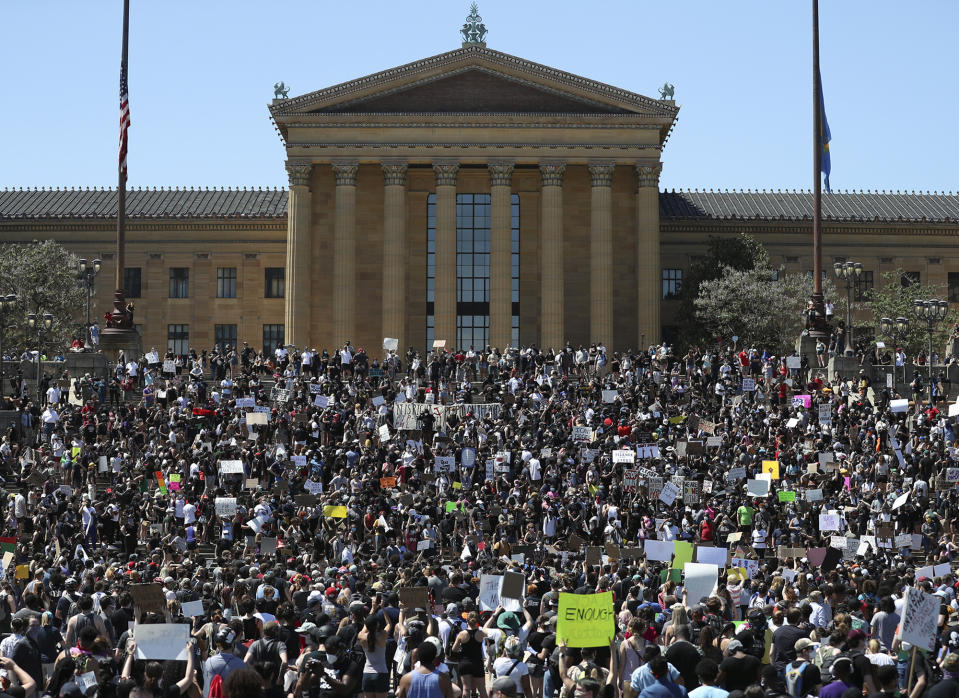 Protesters take to the Art Museum steps in Philadelphia, Saturday, May 30, 2020, during a protest over the death of George Floyd. Floyd died in Minneapolis police custody on May 25. (Heather Khalifa/The Philadelphia Inquirer via AP)