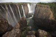 Water pours over the edge of Victoria Falls