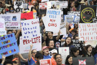 <p>Demonstrators cheer during a March for Our Lives protest for gun legislation and school safety in Houston, Texas. (AP Photo/David J. Phillip) </p>