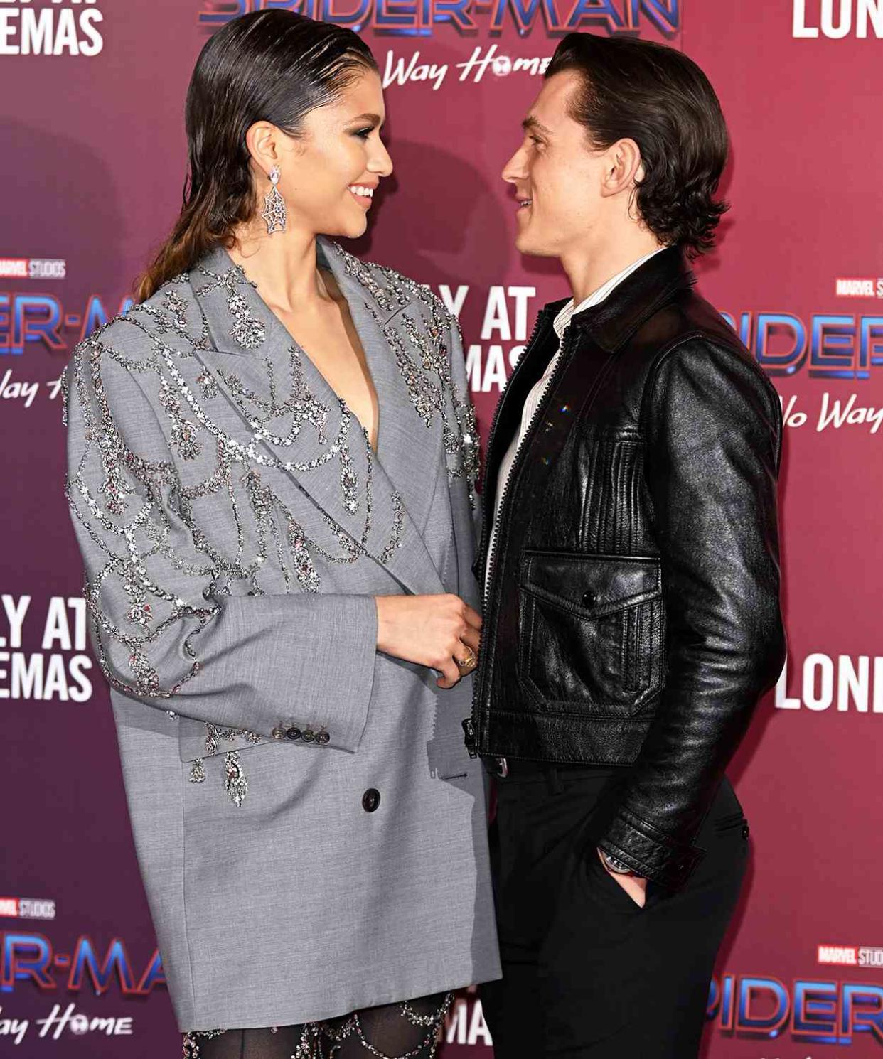 Zendaya and Tom Holland attend a photocall for "Spiderman: No Way Home" at The Old Sessions House on December 05, 2021 in London, England.