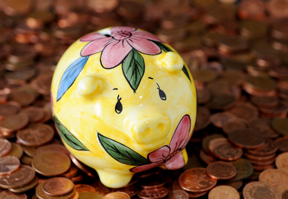 A piggy bank on a pile of coins.   (Photo by Nick Ansell/PA Images via Getty Images)