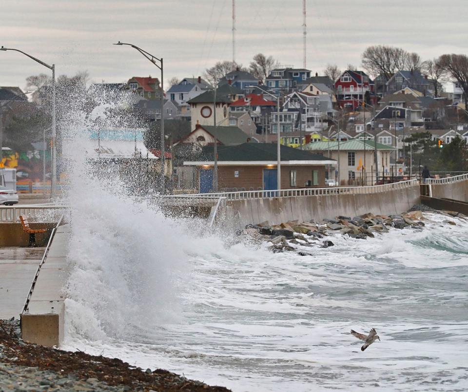 Super high tide waves break along the Nantasket Beach sea wall in Hull on Monday, Jan. 3, 2022.