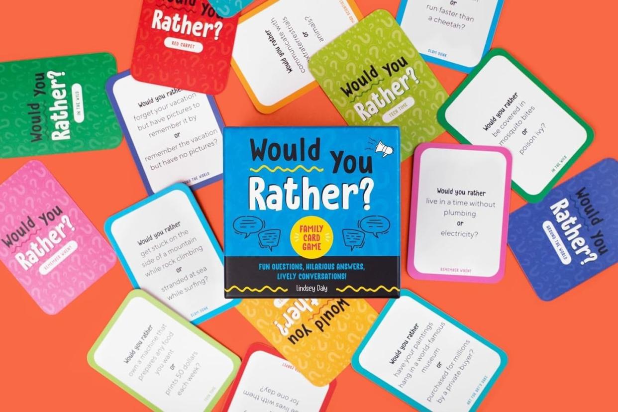 would you rather cards scattered around on a red background